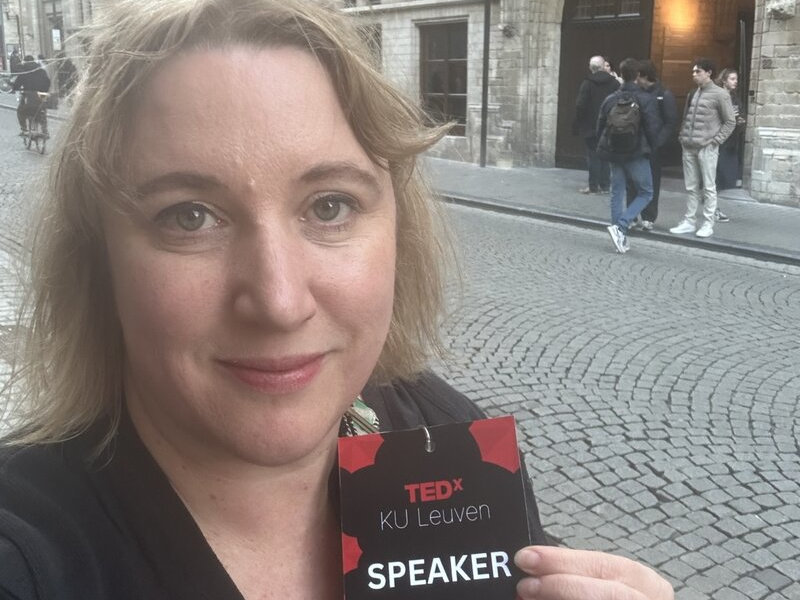 Carla with her TEDx Speaker pass, outside venue